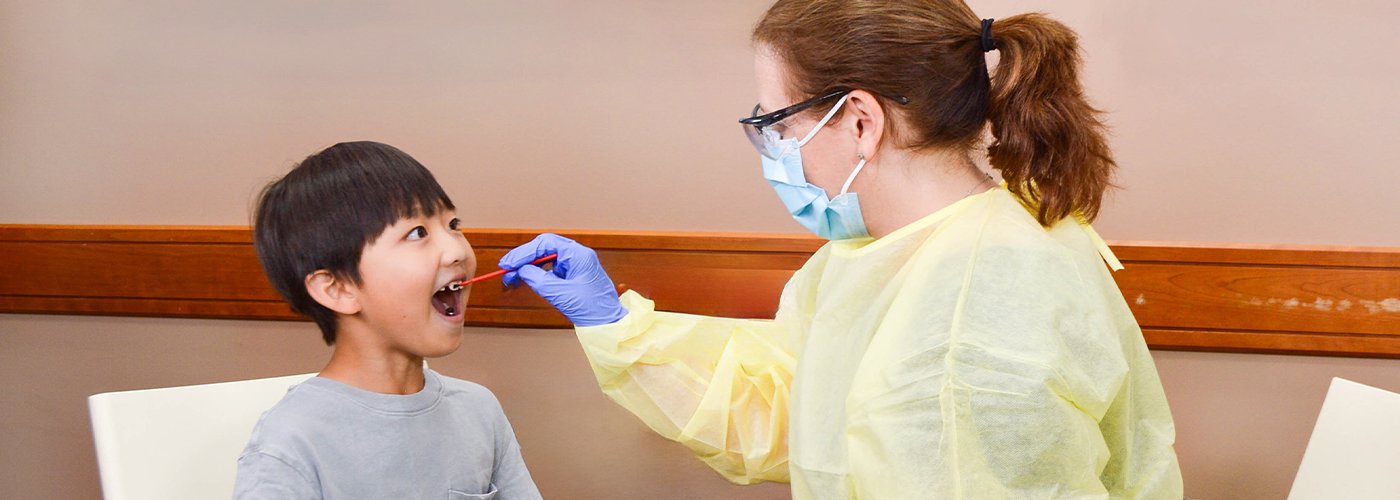 Child receiving fluoride varnish treatment