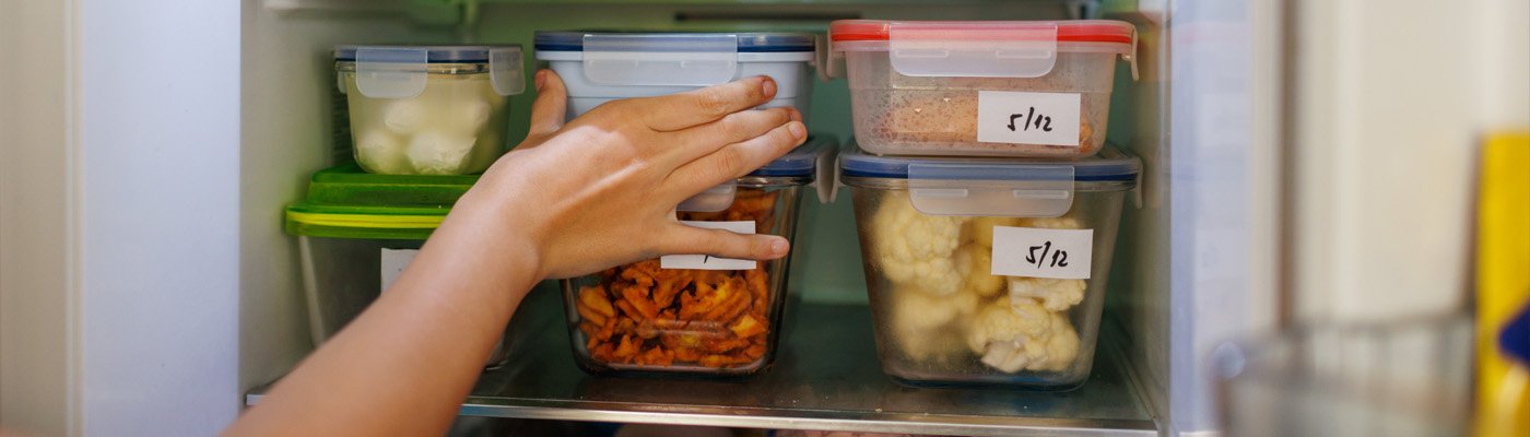 hand reaching for a food container