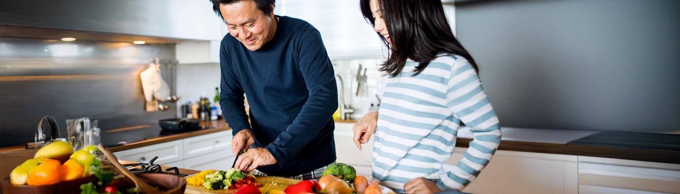 Adult and teen preparing a meal