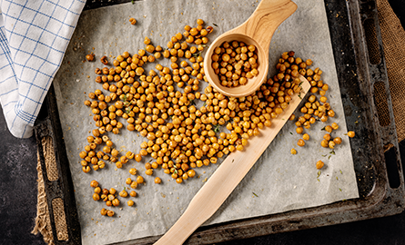 Chickpeas roasting on a baking sheet